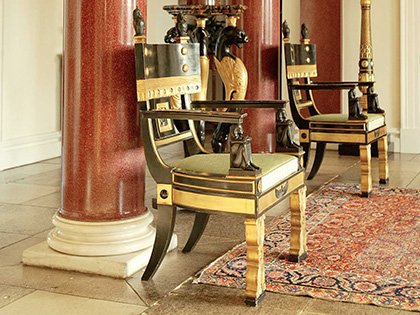 Pair of ebonised and gilt chairs from the Thomas Hope suite