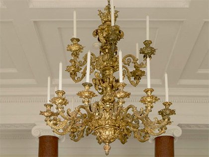 The entrance hall's gilt-metal chandelier from Barnsley Park