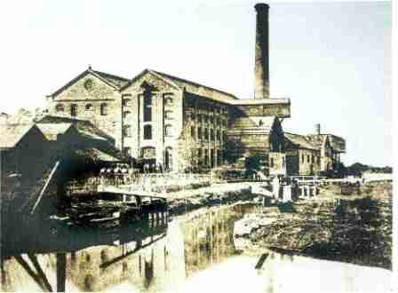 The distillery set up in 1869 by Robert Campbell, on the island near Buscot lock, and closed in 1879; the photograph appears to show the distillery being worked and so was presumably taken between these two dates.